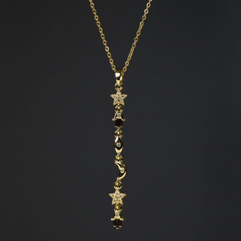 SVORA gold plated stainless steel Hamsa Talisman Charm Necklace with stars, moons, and eyes.