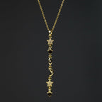 SVORA gold plated stainless steel Hamsa Talisman Charm Necklace with stars, moons, and eyes.
