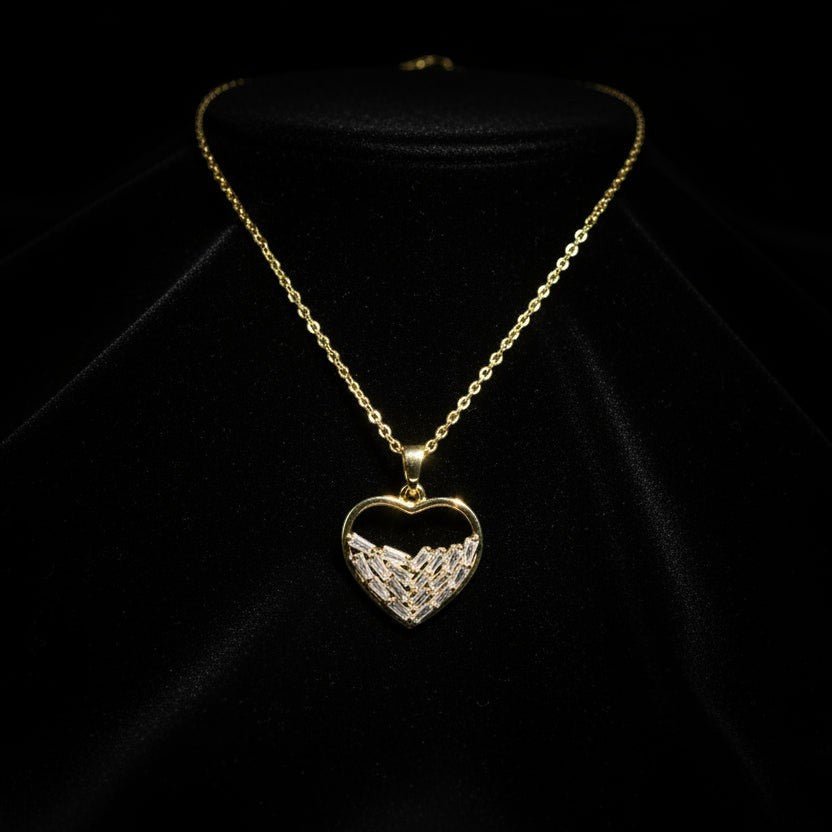 SVORA gold plated stainless steel necklace with a heart pendant filled with baguette-cut cubic zirconia stones.