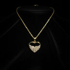 SVORA gold plated stainless steel necklace with a heart pendant filled with baguette-cut cubic zirconia stones.