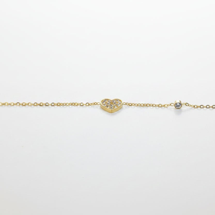 SVORA gold plated stainless steel bracelet with a CZ-pavé heart charm and a round stone accent.