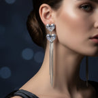 SVORA silver-tone dangle earrings with two heart-shaped cubic zirconia clusters and long snake chain tassels.
