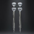 SVORA silver-tone dangle earrings with heart-shaped cubic zirconia and snake chain tassels.