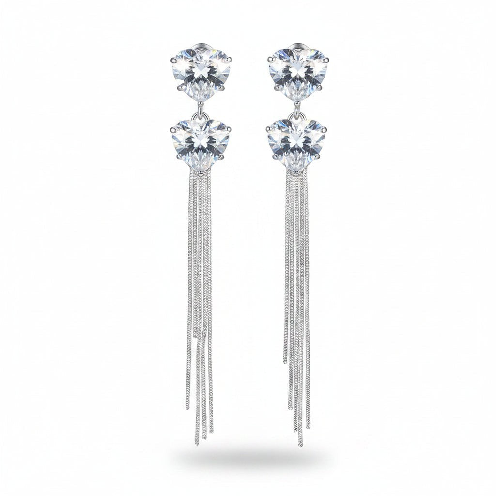 SVORA silver-tone dangle earrings with heart-shaped cubic zirconia and snake chain tassels.