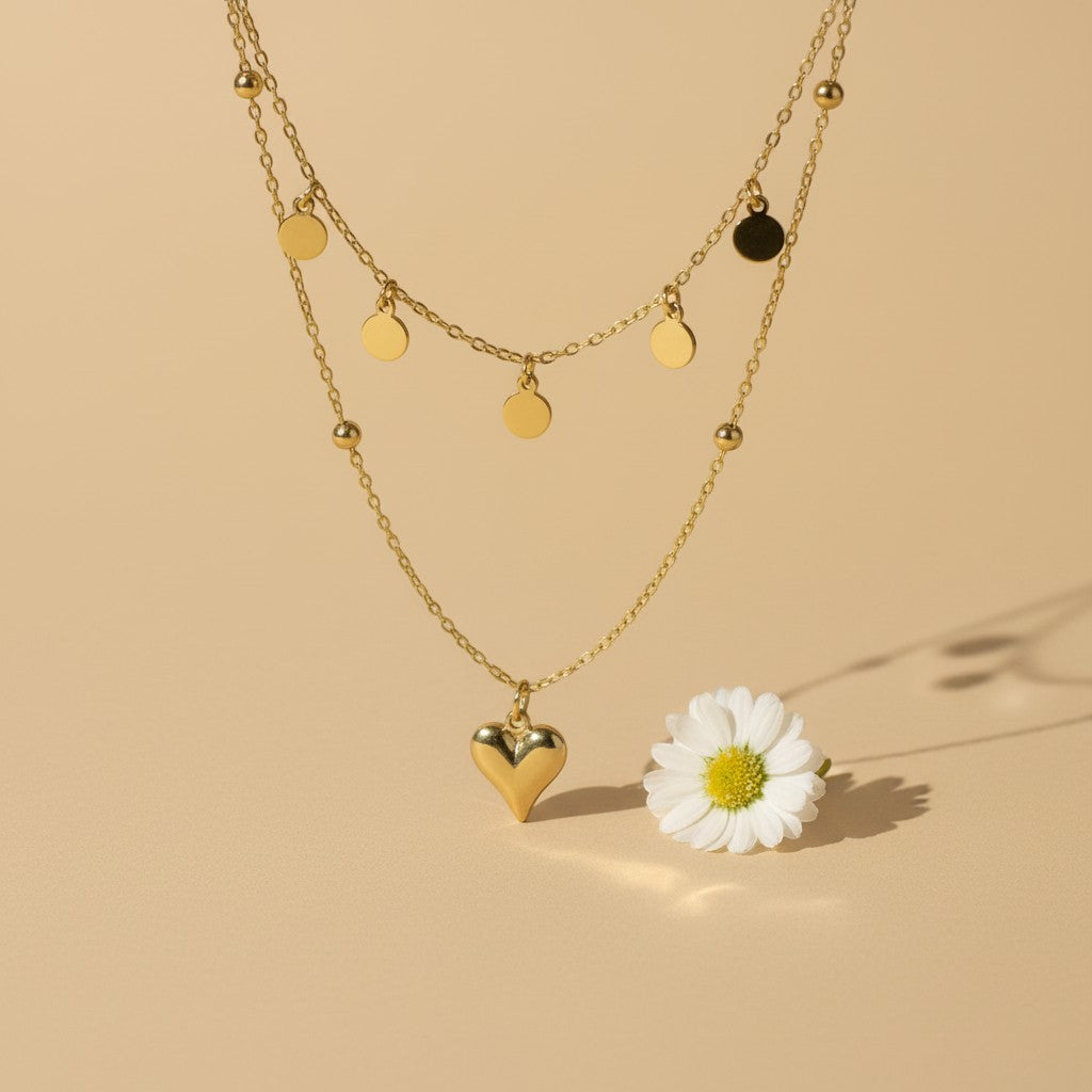 SVORA gold stainless steel layered necklace with heart and disc charms, tarnish-resistant and waterproof.