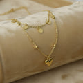 SVORA gold stainless steel layered necklace with heart and disc charms, tarnish-resistant