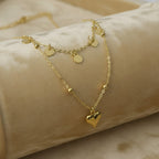 SVORA gold stainless steel layered necklace with heart and disc charms, tarnish-resistant