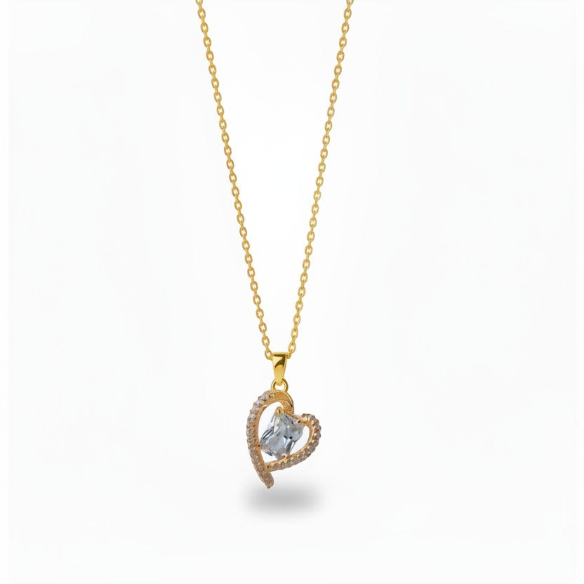 SVORA gold-plated stainless steel necklace with a heart-shaped pendant adorned with clear crystals.