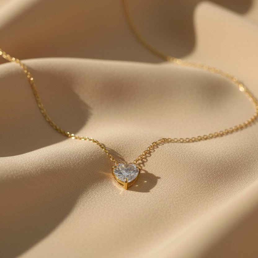 SVORA gold-plated stainless steel necklace with a clear heart-cut cubic zirconia solitaire pendant.