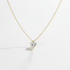 SVORA gold plated stainless steel necklace with a clear heart-cut cubic zirconia solitaire pendant.