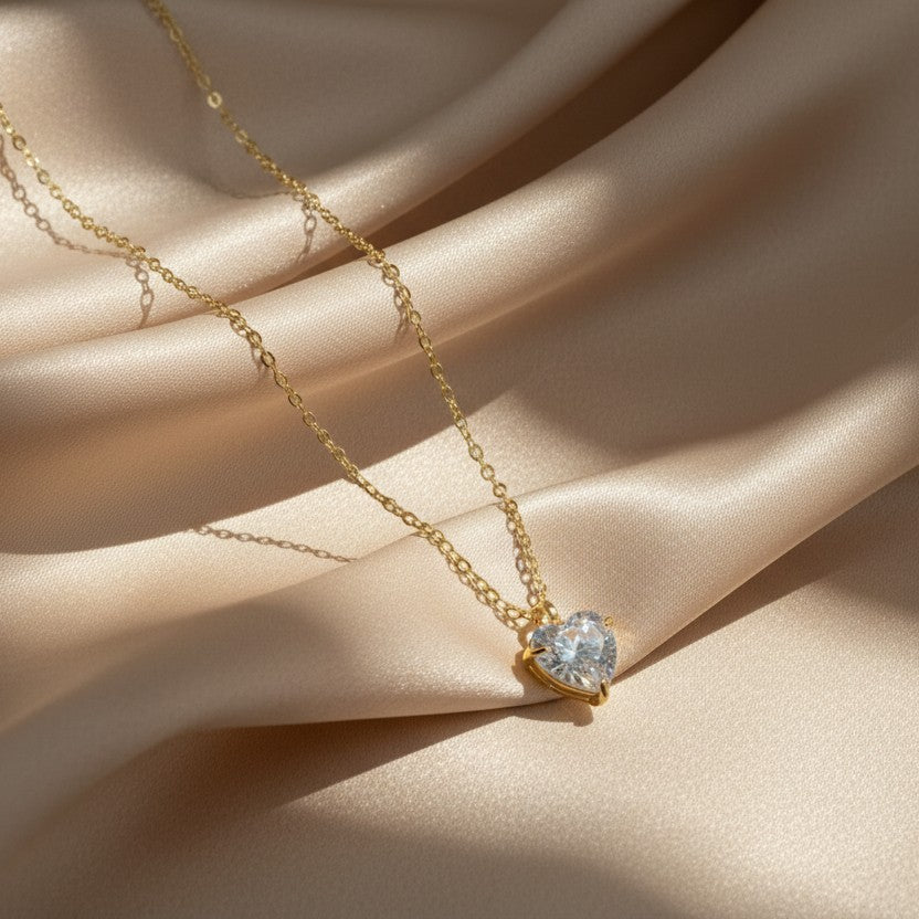 SVORA gold-plated stainless steel necklace with a clear heart-shaped cubic zirconia pendant.