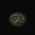 SVORA gold-tone stainless steel hexagon hoop earrings with a polished finish. Modern, minimal, and elegant design.