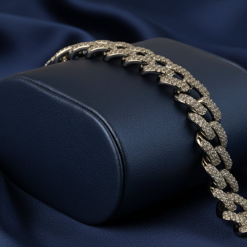 SVORA iced Cuban link bracelet with white CZ stones, rhodium-plated stainless steel, secure box clasp.