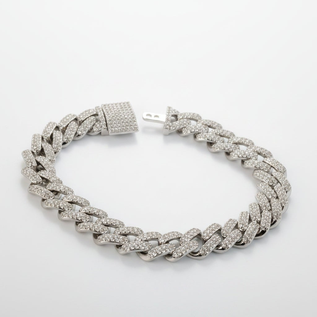 SVORA iced Cuban link bracelet in silver with white CZ stones and a secure box clasp. Made from 316L stainless steel.