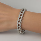 SVORA iced Cuban link bracelet with white CZ stones on a wrist. Silver-tone, rhodium plated stainless steel.