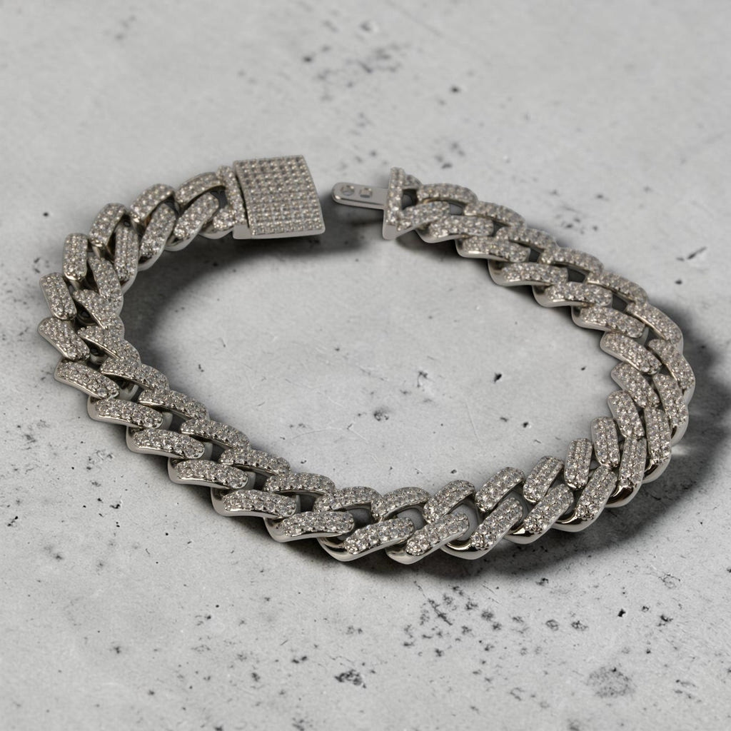 SVORA iced Cuban link bracelet with white CZ stones and a secure box clasp, made of silver-toned stainless steel.