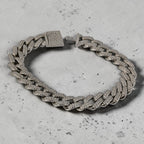 SVORA iced Cuban link bracelet with white CZ stones and a secure box clasp, made of silver-toned stainless steel.