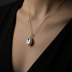 SVORA lavender rose pendant necklace with gold stem on a pearl.