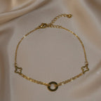 SVORA gold layered chain bracelet with hollow circle and clover charms. Adjustable, lobster clasp, 18K gold plated stainless steel.