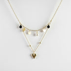 SVORA gold layered necklace with heart, disc, and pearl charms. Stainless steel, 18k gold plated.