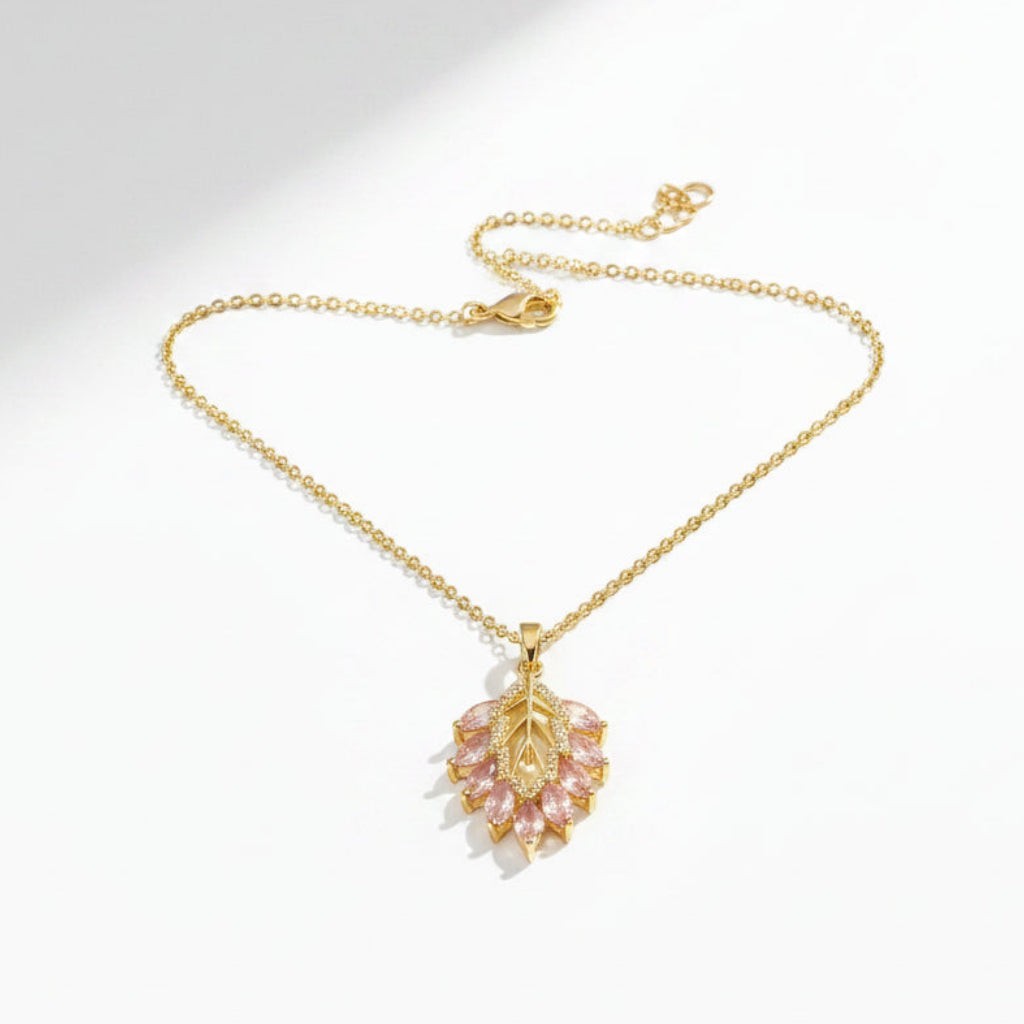 SVORA gold plated stainless steel necklace with a blush pink marquise leaf pendant adorned with white CZ stones.