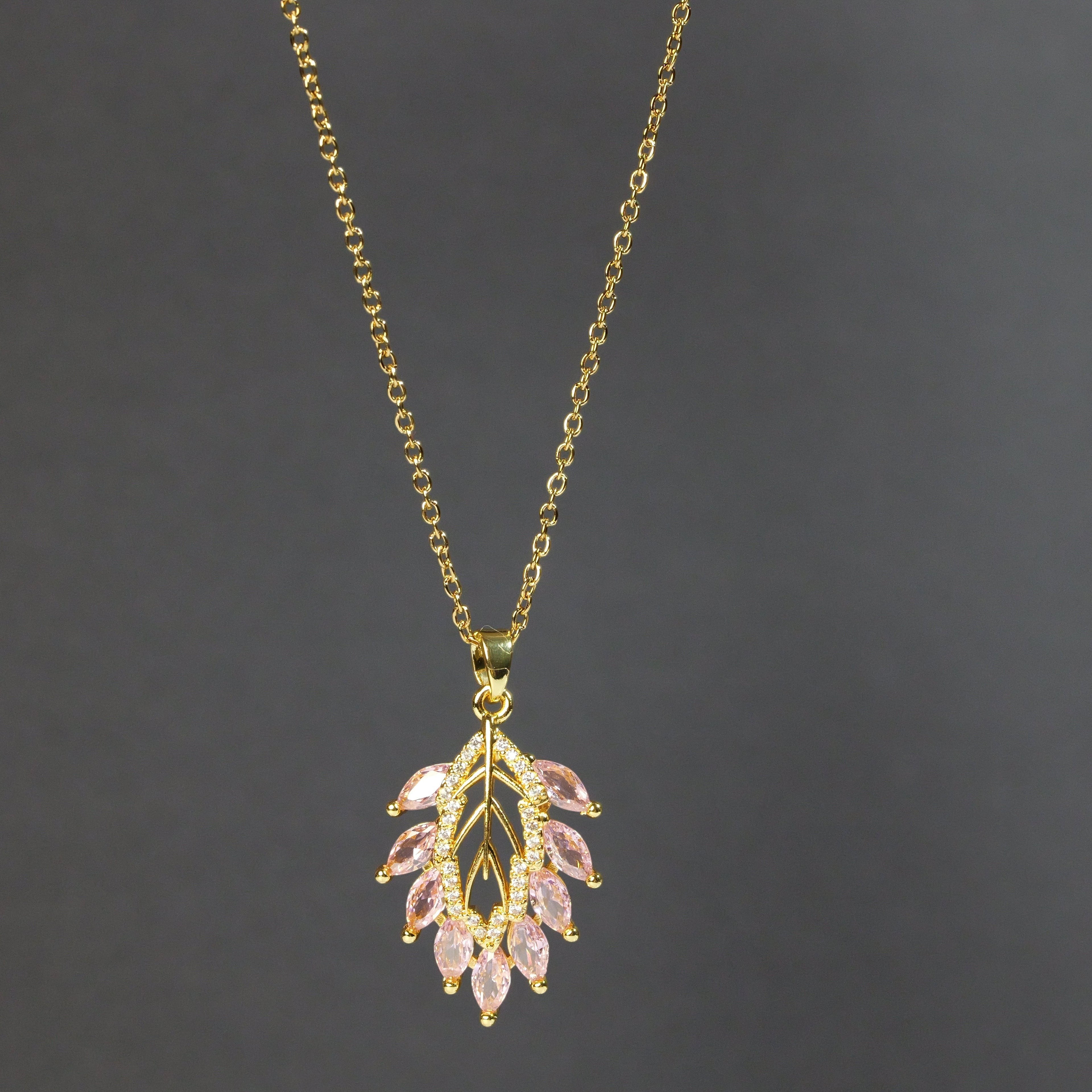 SVORA gold plated stainless steel necklace with a blush pink marquise CZ leaf pendant and white CZ accents.
