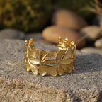 SVORA gold plated stainless steel Lotus Open Cuff Bracelet with textured petals. Adjustable.