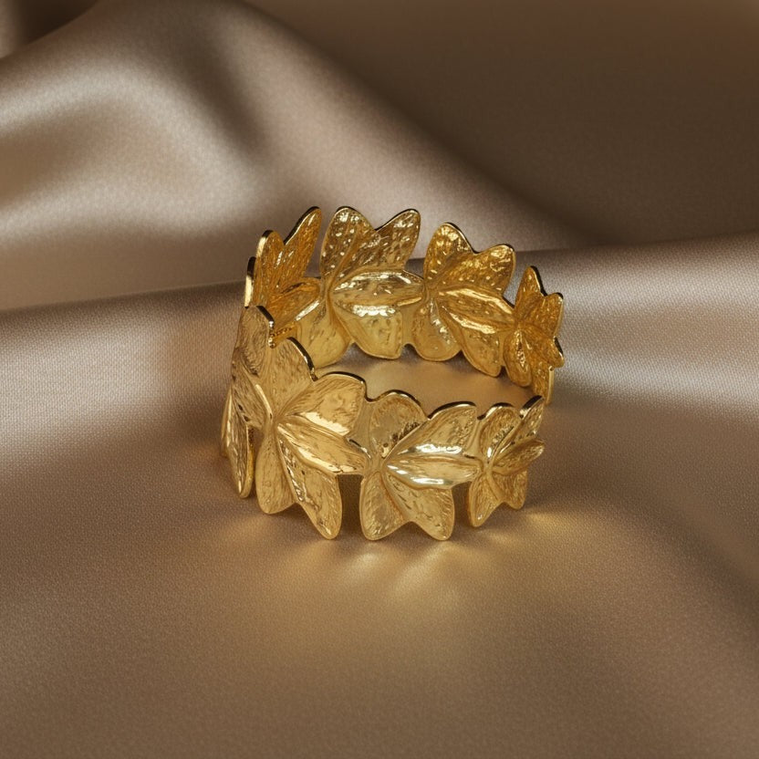 SVORA gold plated stainless steel Lotus Open Cuff Bracelet with floral petal design. Adjustable and hypoallergenic.