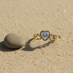 SVORA Lumiere Amour Heart Ring with a clear heart-cut stone, 18K gold plated stainless steel band with heart details.
