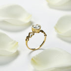 SVORA Lumiere Amour gold heart ring with clear stone, featuring open heart details on the band. 18K gold plated.