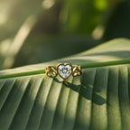 SVORA Lumiere Amour gold plated heart ring with clear stone and heart cutouts on band.