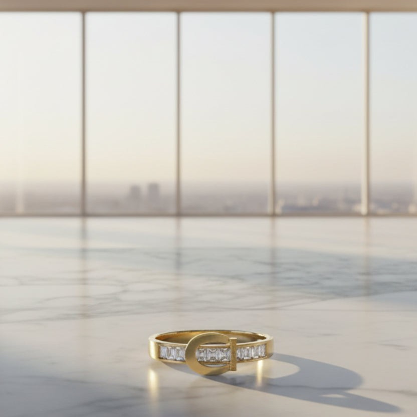 SVORA Lumiere Belt Eternity Ring in gold tone stainless steel with channel-set baguette cubic zirconia stones, inspired by a belt buckle.