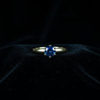 SVORA Lumiere Blue Solitaire Ring with a sapphire blue cubic zirconia set in 18K gold plated stainless steel.