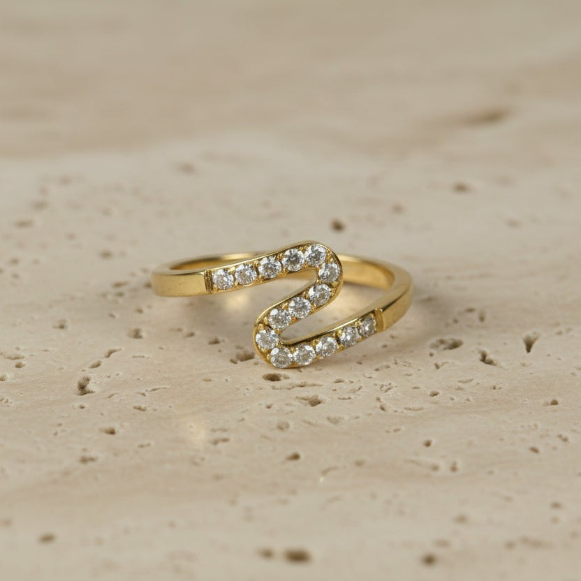 SVORA gold plated stainless steel Lumiere Chevron Slim Ring with small stones along a zigzag line.