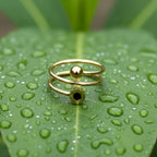 SVORA Lumiere Eclipse Spiral Ring in gold-tone stainless steel with a polished finish and a black accent.