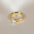 SVORA Lumiere Princess Solitaire Ring in gold, featuring a princess-cut cubic zirconia on a brushed gold band. Bezel-set for a secure and modern look.