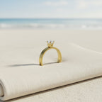 SVORA Lumiere Princess Solitaire Ring in gold-plated stainless steel with a princess-cut diamond on a thick band.