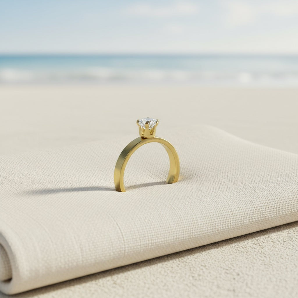 SVORA Lumiere Princess Solitaire Ring in gold-plated stainless steel with a princess-cut diamond on a thick band.