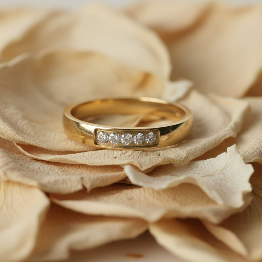 SVORA Lumiere Promise Five Stone Ring in gold-plated stainless steel with channel-set diamonds.