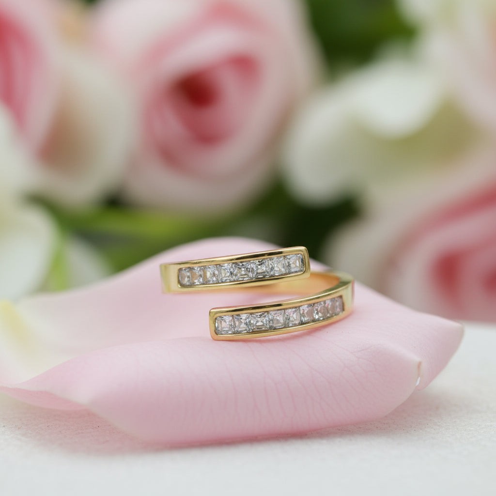 SVORA Lumiere Twin Spark Ring in gold tone, 18K gold plated stainless steel with channel-set cubic zirconia.