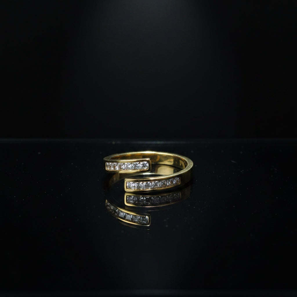 SVORA Lumiere Twin Spark Ring in gold tone, 18K gold plated stainless steel with crystal white cubic zirconia. Wrap design.