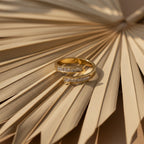 SVORA Lumiere Twin Spark Ring, gold-tone stainless steel with crystal white cubic zirconia accents, wrap design.