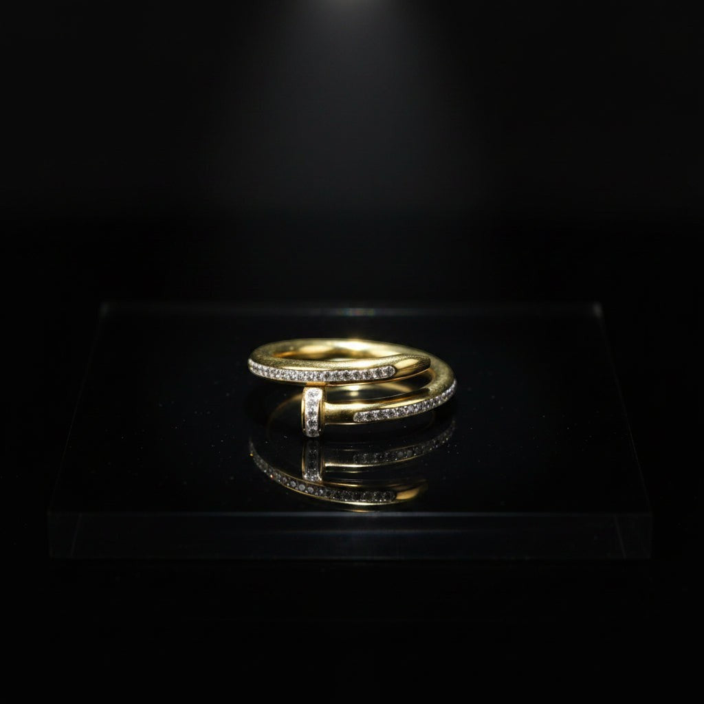 SVORA Lumiere Twist Wrap Ring in gold, made of 18K gold-plated stainless steel with pavé-set diamonds.