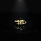 SVORA Lumiere Twist Wrap Ring in gold, made of 18K gold-plated stainless steel with pavé-set diamonds.