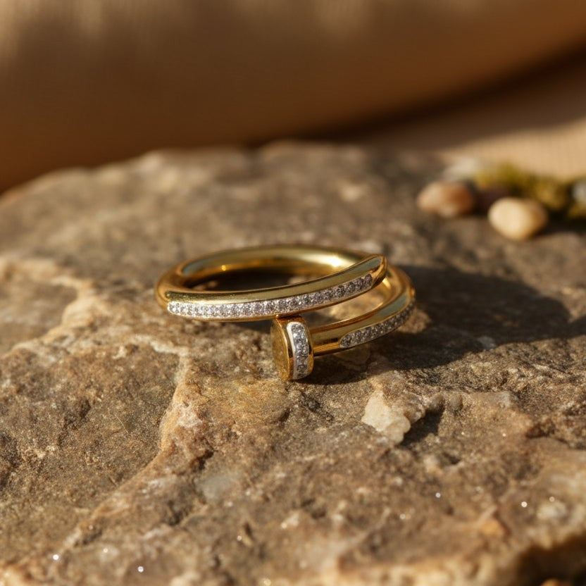 SVORA gold plated stainless steel Lumiere Twist Wrap Ring with pavé-set band and rounded head.