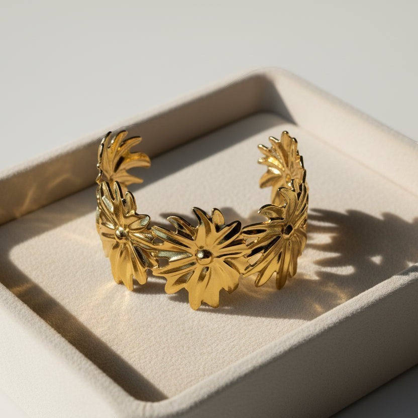 SVORA Marigold Bloom Cuff Bracelet, 18K gold plated stainless steel with five oversized floral blooms, adjustable.