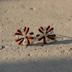 SVORA maroon flower crystal stud earrings with alternating dark maroon enamel and clear baguette crystal petals. Gold tone.