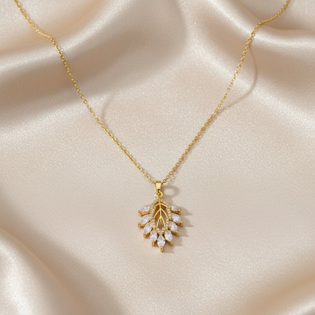 SVORA Marquise Leaf Cluster Pendant with clear CZ stones and gold plated stainless steel.