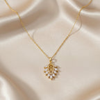 SVORA Marquise Leaf Cluster Pendant with clear CZ stones and gold plated stainless steel.