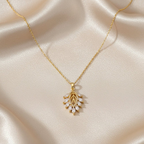 SVORA Marquise Leaf Cluster Pendant with clear CZ stones and gold plated stainless steel.